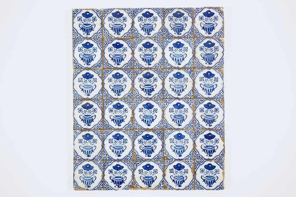 A field of 30 Dutch Delft blue and white flowervase tiles, 17th C.
